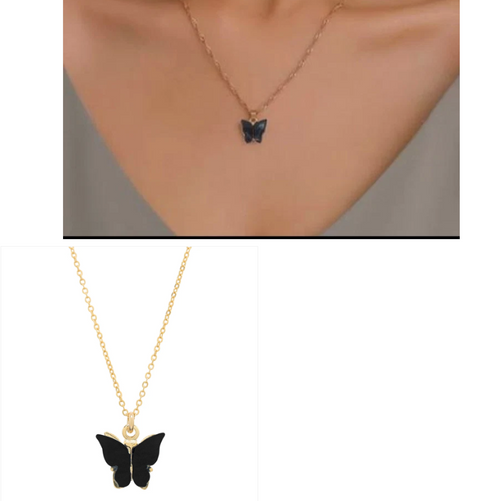 Black butterfly pendant necklace on gold chain worn as a delicate charm necklace